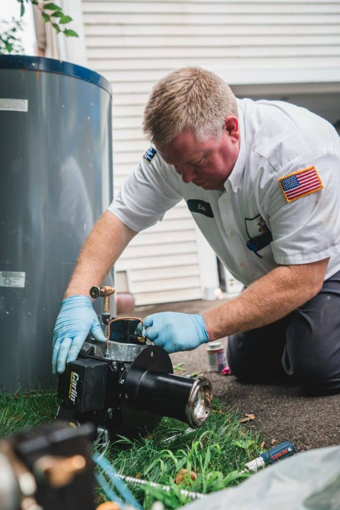 Eric working on a water heater repair.